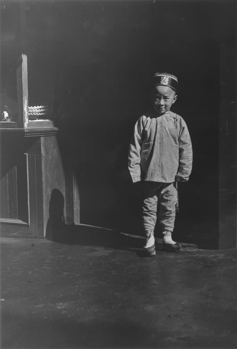 Boy in Doorway of Lamp Store