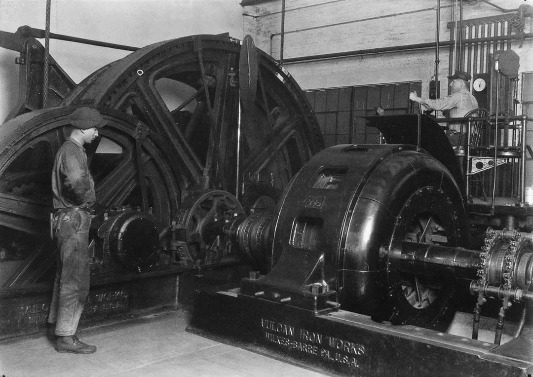 Workers operating machinery manufactured by Vulcan Iron Works, ca. 1925