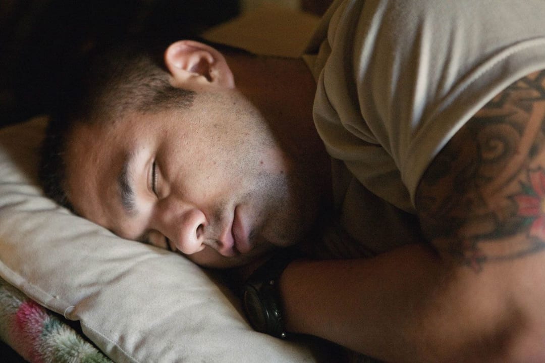 Sergeant Aaron Hijar, 2nd Platoon, Battle Company, sleeping in the Korengal Valley, Kunar Province, Afghanistan. July 2008...