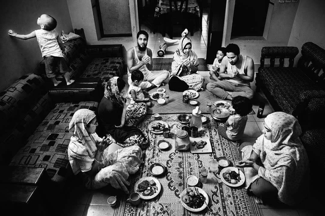 After fasting all day, the whole family is having Iftar during Ramadan. Three brothers — me, Arman, and Ataul — and our fa...
