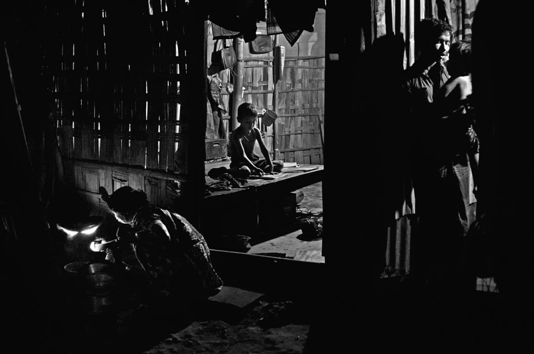 Roni (8) works in a scrap metal shop during the day. His parents want him to study, and he attends lessons at an NGO-run s...