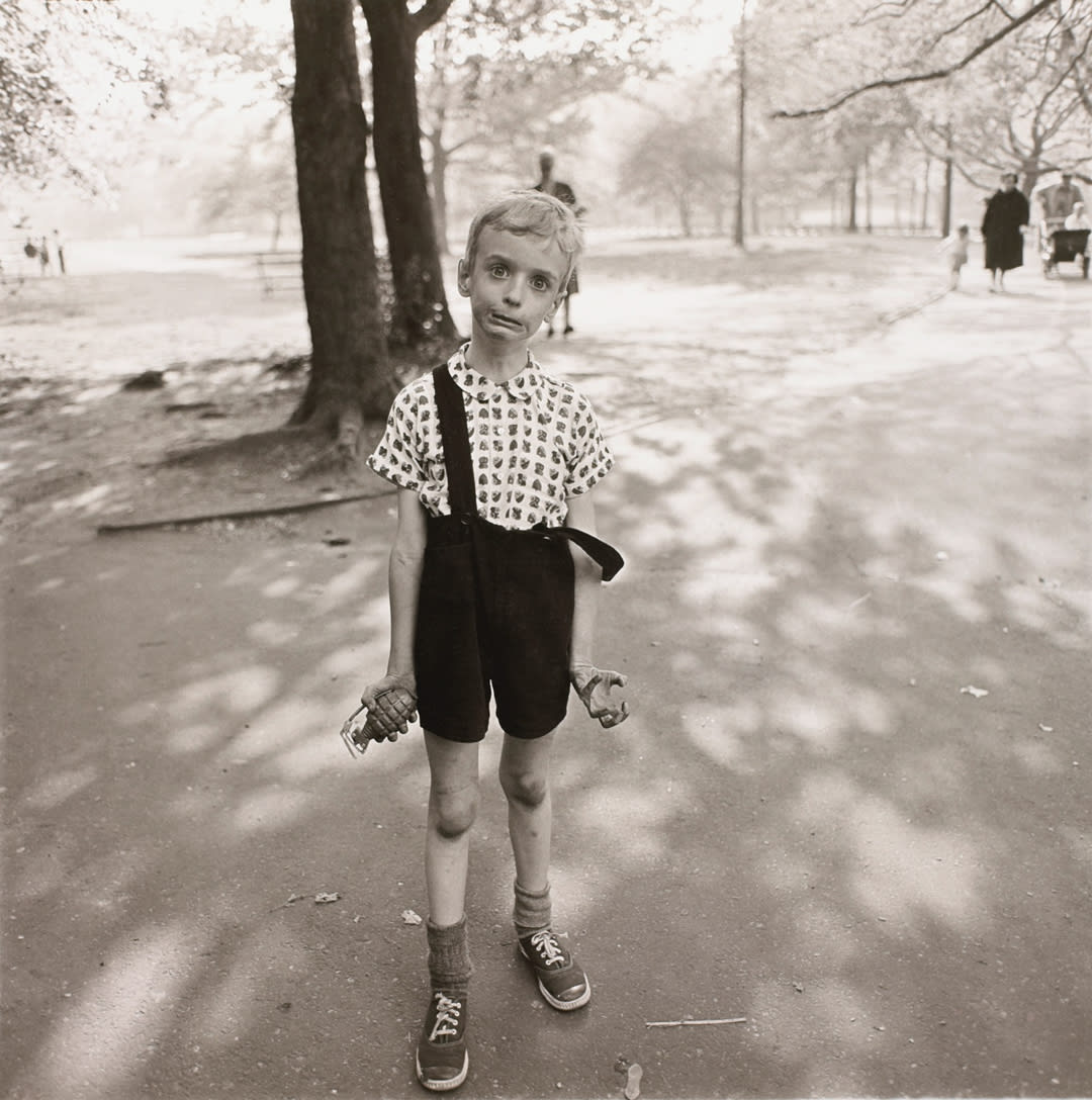 Child with a toy hand grenade in Central Park, N.Y.C. 1962