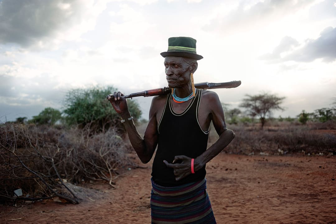 Kenya, Turkana County, Lobei village. Loduung Elimlin, a 50-year-old shepherd from the Turkana tribe, is photographed with...