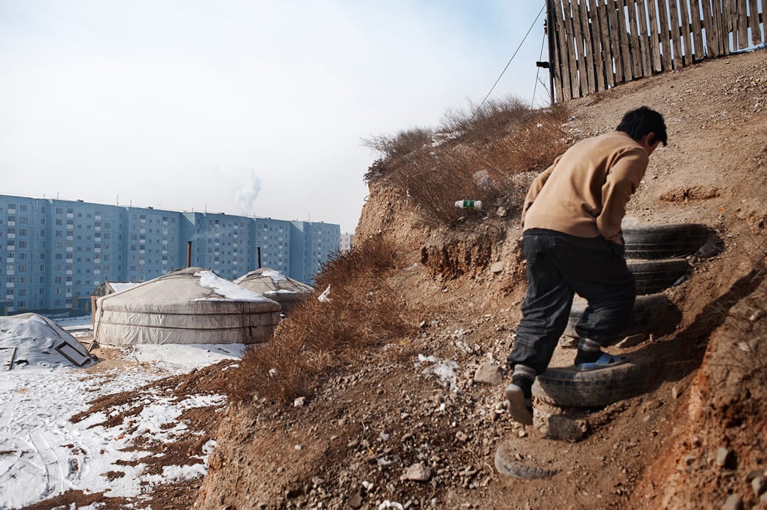 Mongolia, Ulaanbaatar. A man walks through the streets of the Ger District. The capital has 1.5 million inhabitants; about...