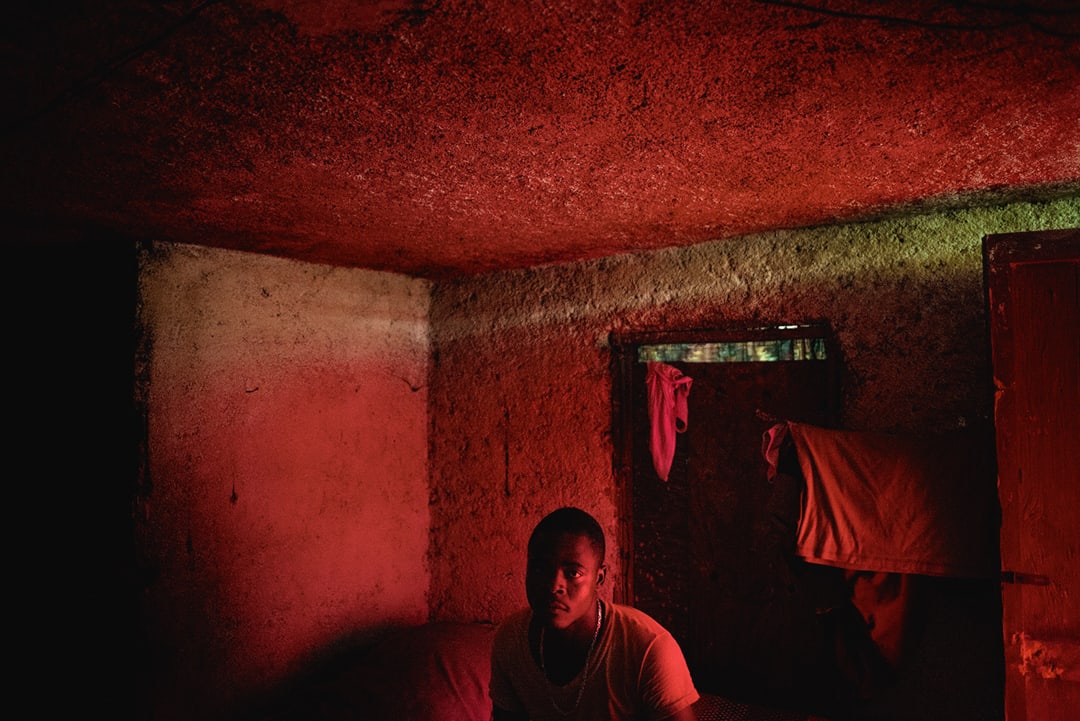 Port au Prince, Haiti. Makendy, an environmental migrant, in his shack in the slum area of Bois Moquette. Makendy, 23 year...