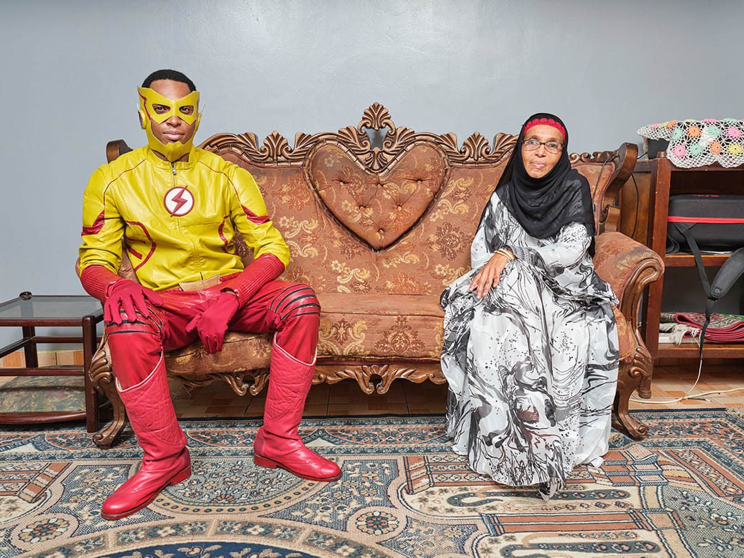 12/01/2024
Fahmy (31), poses with his mother in their living room in Nairobi, Kenya; he is a TV producer, has been practic...