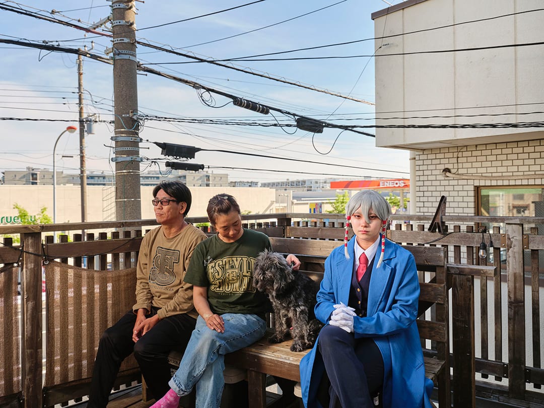 14/05/2024 
Utsuro (17) with her parents and dog on their balcony, Kanagawa, Japan. 
A student and cosplayer for 3 years, ...