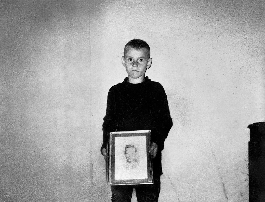 Self-portrait with the picture of my biggest brother, Everett, who killed himself when he came back from Vietnam. Photogra...