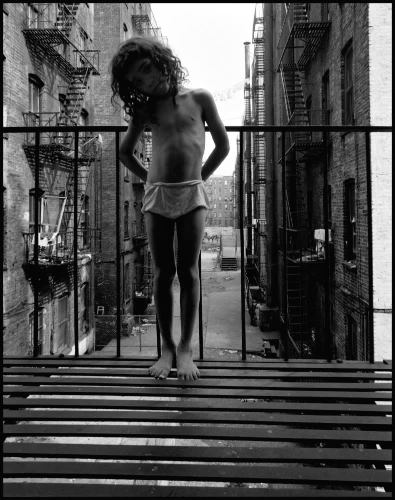 Little girl on a fire escape. East 100th Street. New York City. USA. 1966. © Bruce Davidson | Magnum Photos