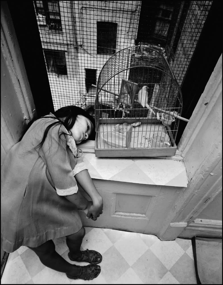 Girl with a birdcage. East 100th Street. New York City. USA. 1966. © Bruce Davidson | Magnum Photos