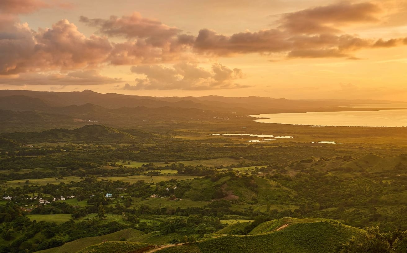 Morning light over Samaná Bay seen from the hills above Miches — the quiet coast of Vista Serena