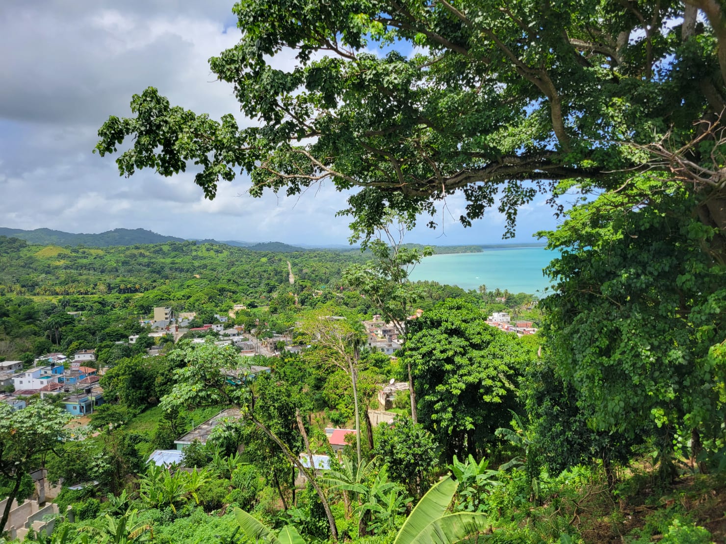 Miches west panoramic view — Costa Esmeralda ocean and mountain, Vista Serena 9-hectare estate Dominican Republic 2026