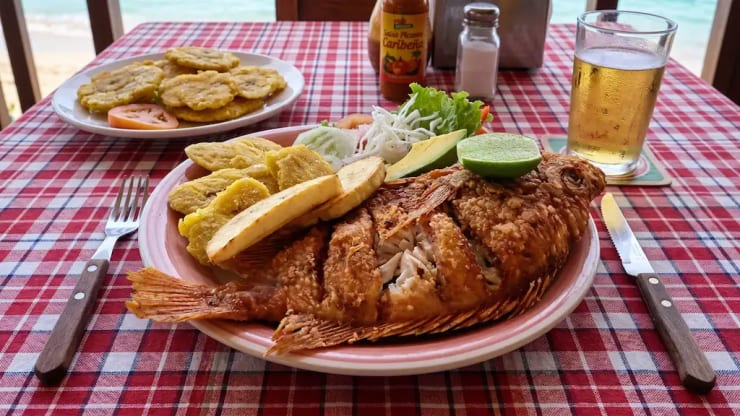 Fried fish with tostones, coastal dish from Miches