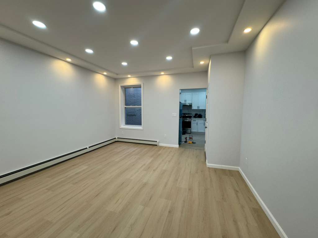 Open plan gut renovation LVP flooring by Fibinachi Construction