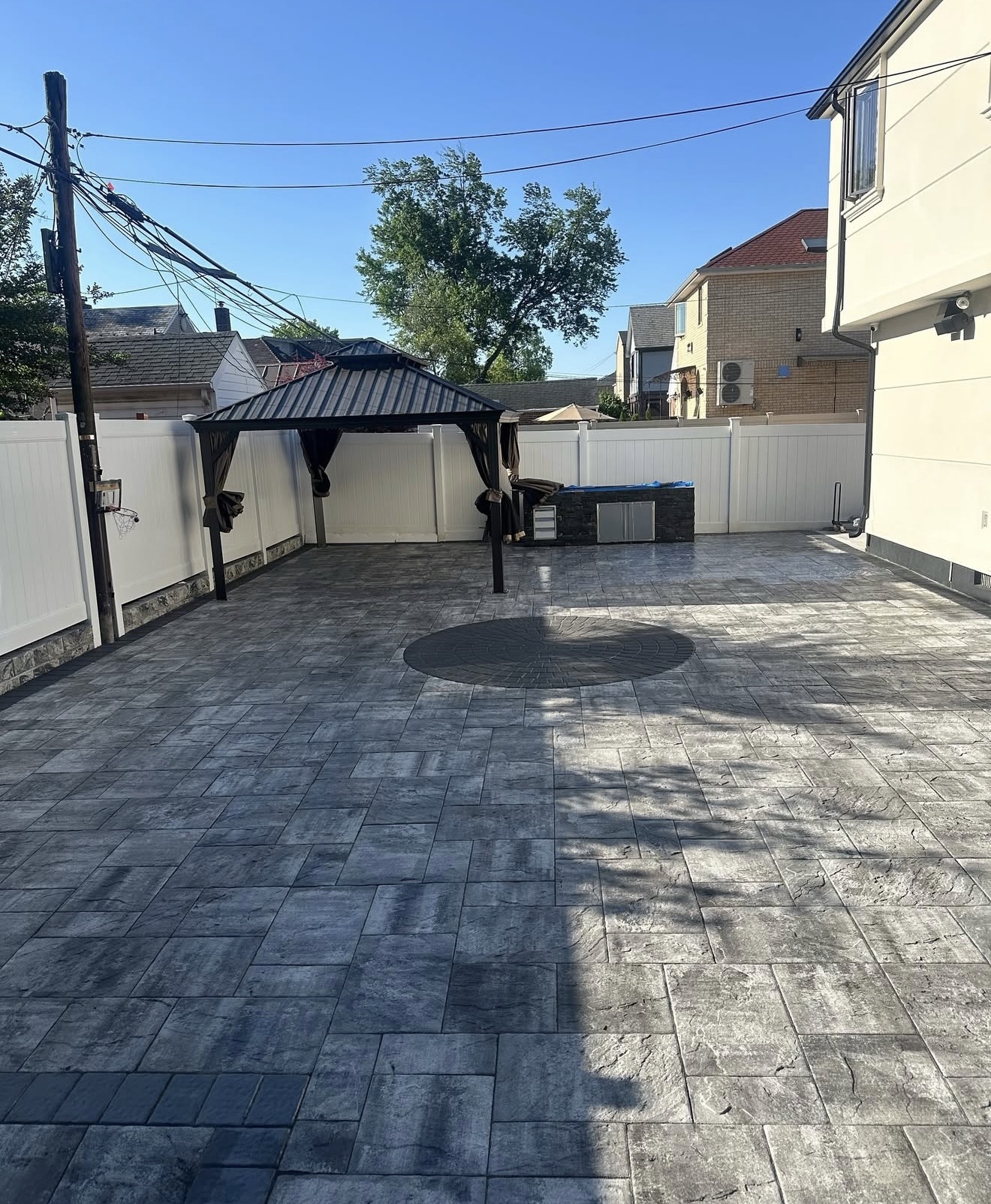Paver patio with gazebo circular inlay by Fibinachi Construction Long Island