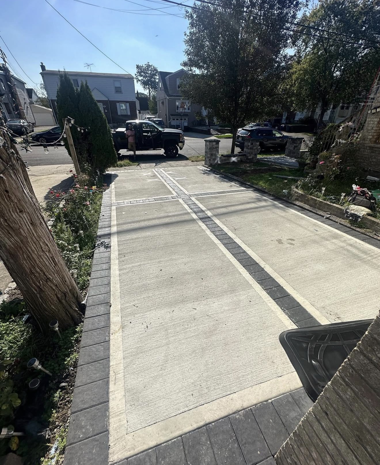 Concrete and paver border driveway by Fibinachi Construction NYC