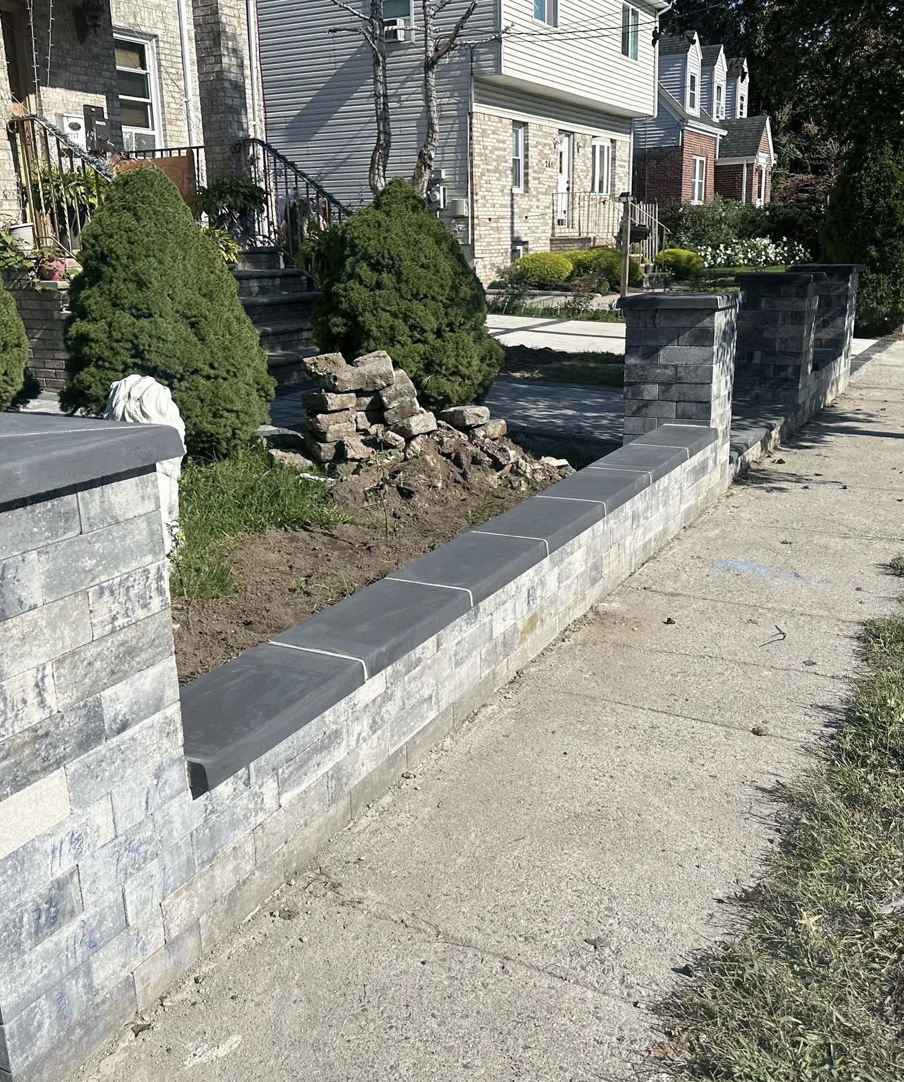 New masonry block wall and pillars by Fibinachi Construction Long Island