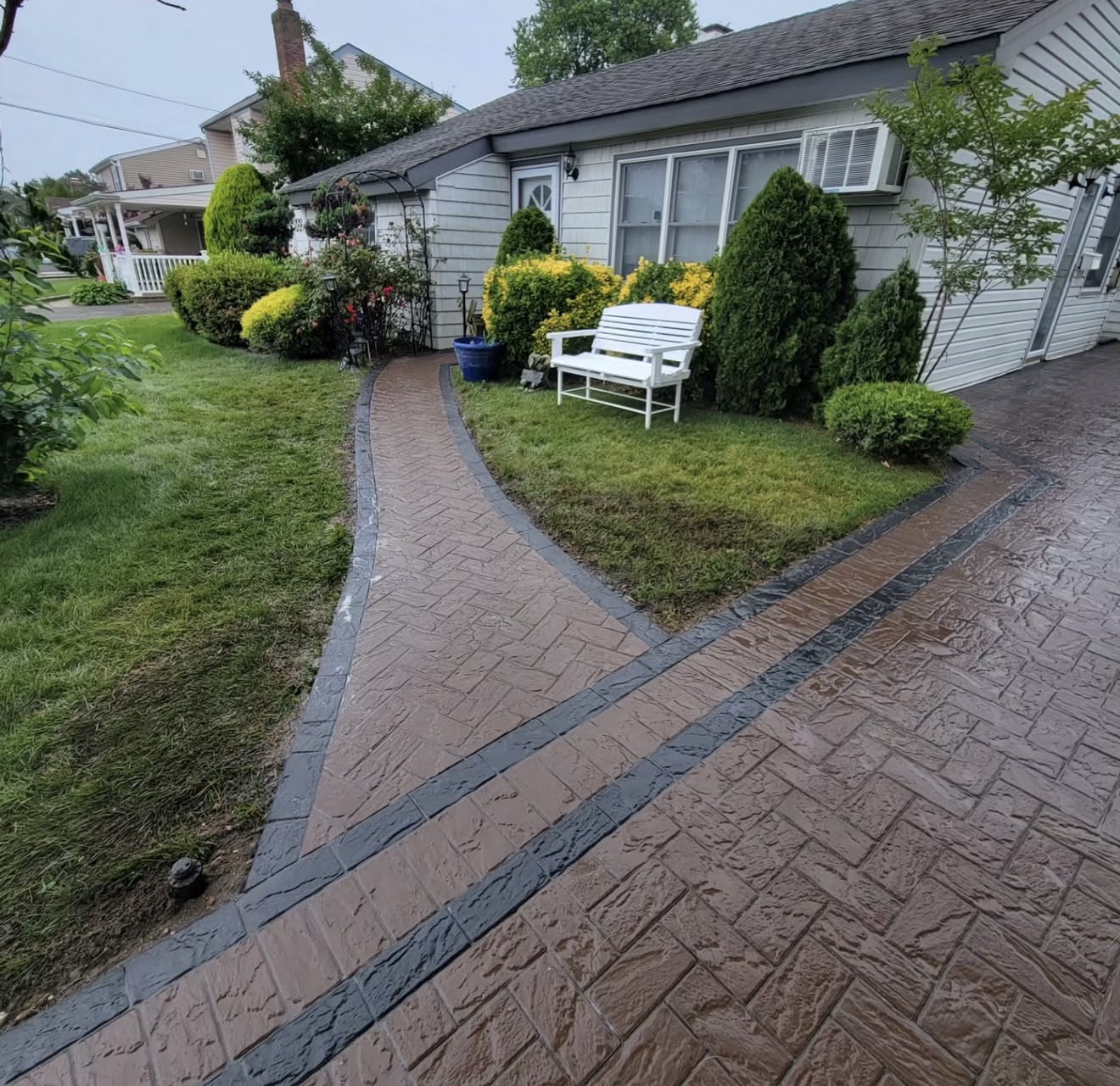 Stamped concrete walkway and driveway by Fibinachi Construction