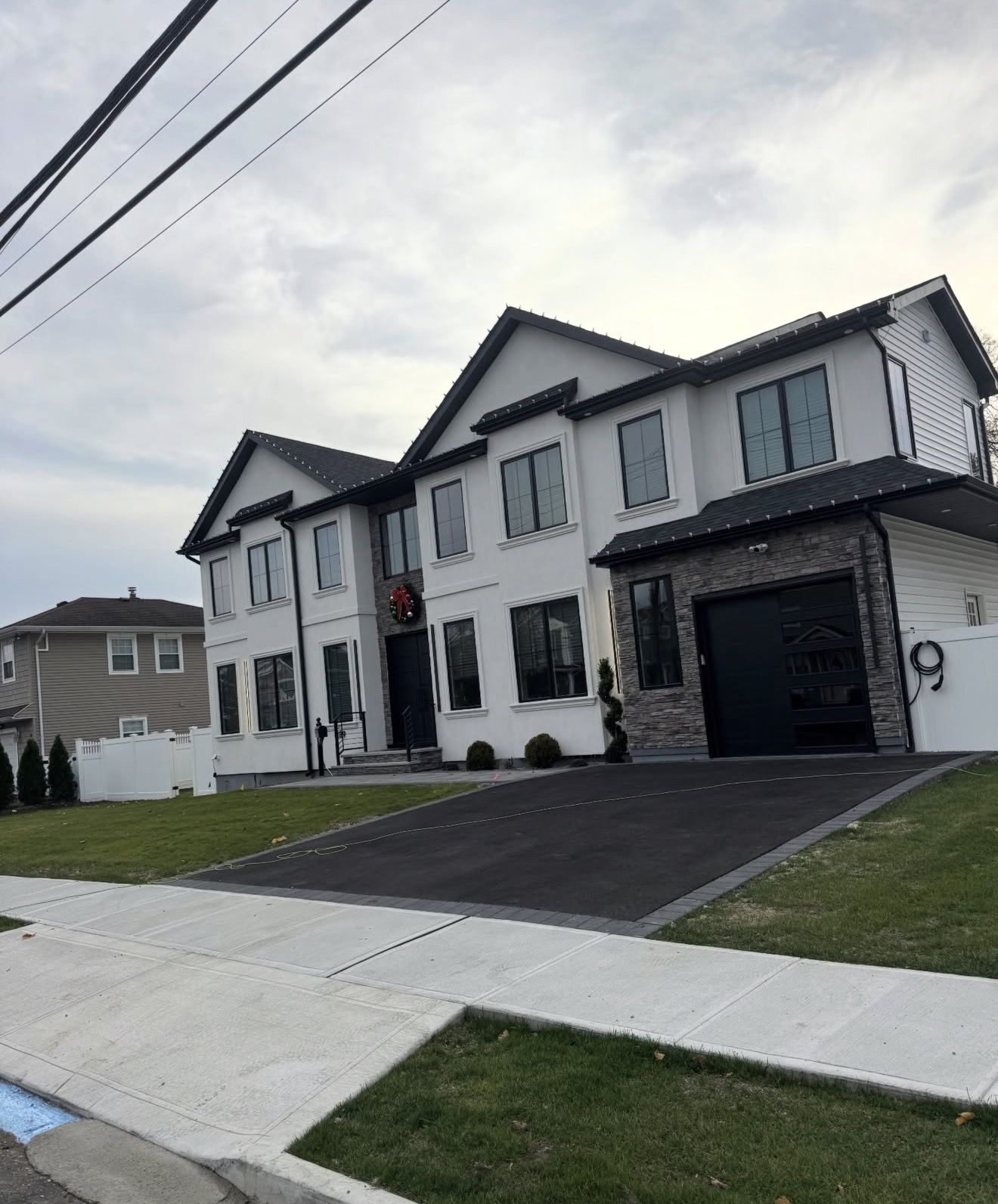 Luxury new construction stucco stone home by Fibinachi Construction Long Island