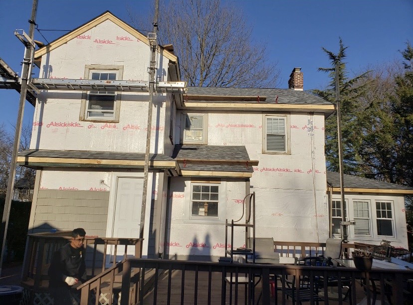 Siding installation in progress Alside by Fibinachi Construction