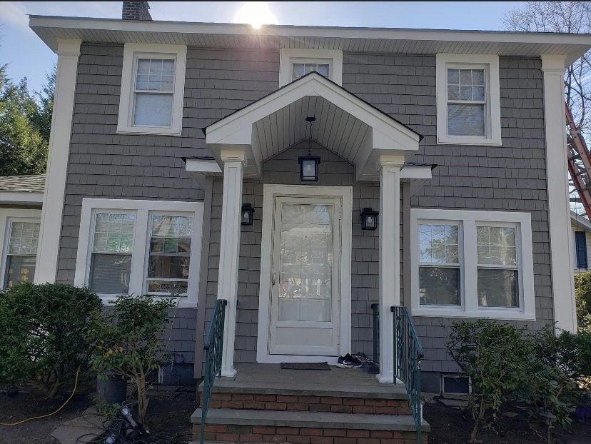 Finished architectural shingle siding home by Fibinachi Construction Long Island