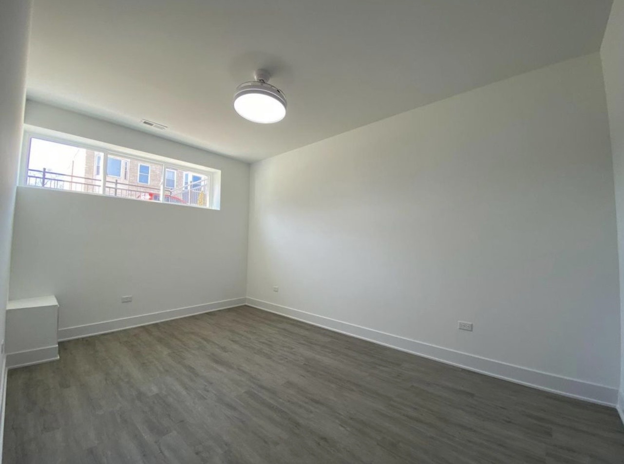 Finished bedroom gut renovation LVP flooring by Fibinachi Construction