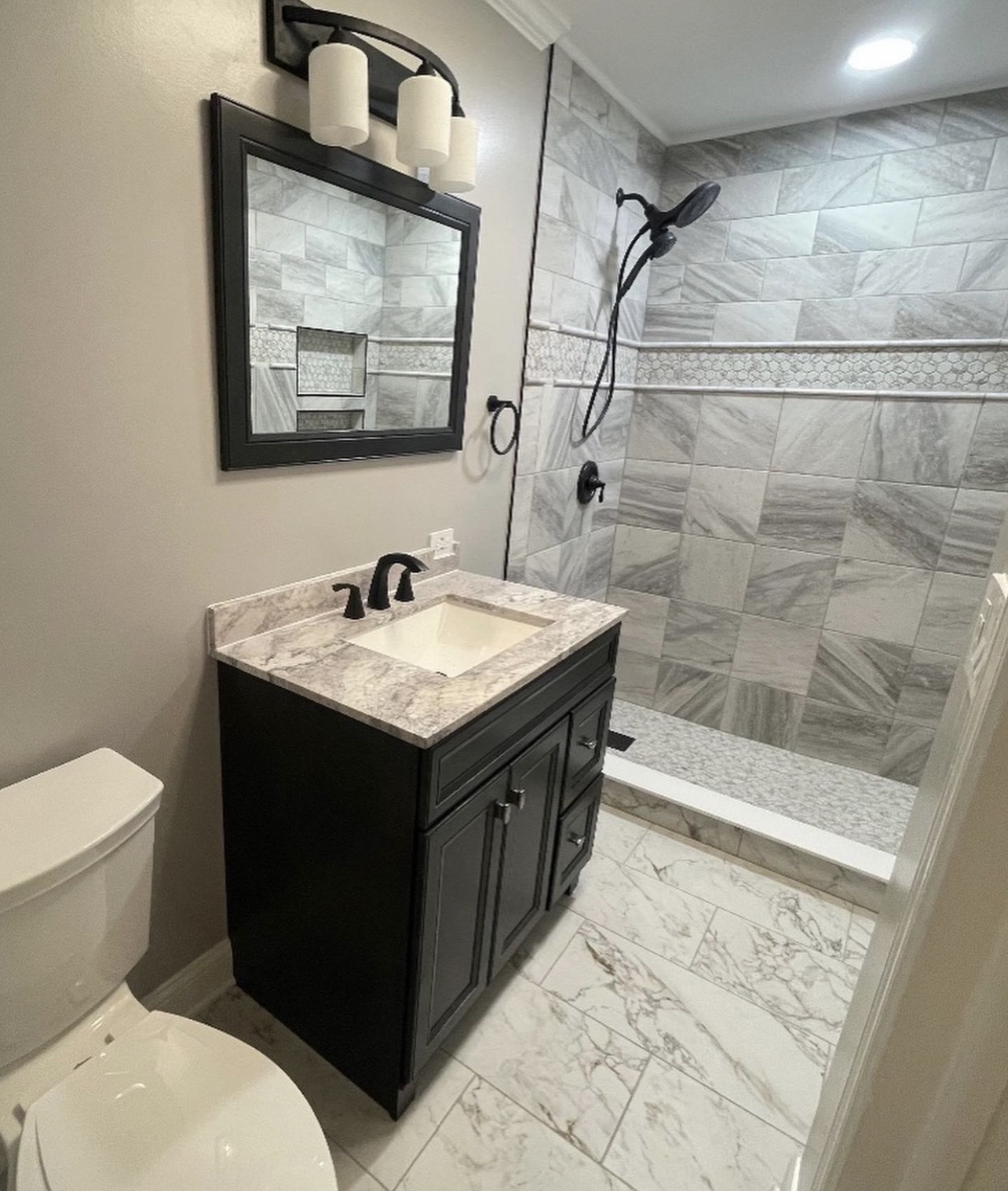 Custom tile shower marble bathroom renovation by Fibinachi Construction