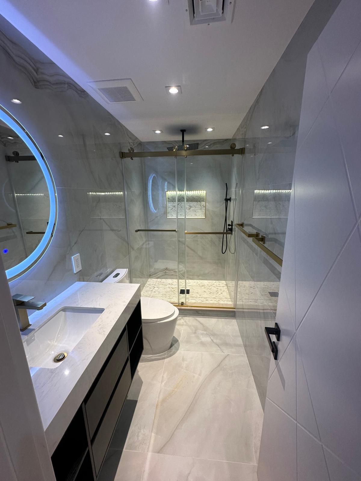 Luxury spa bathroom renovation LED mirror by Fibinachi Construction NYC