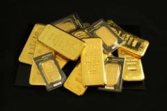 A collection of precious gold bars stacked elegantly, symbolizing wealth and prosperity.