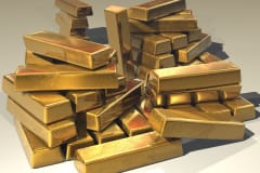 A pile of lustrous gold bars symbolizing wealth and prosperity.