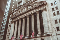 Historic New York Stock Exchange building facade captured in a vintage style.