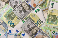 A detailed view of American and Euro currency notes, emphasizing global finance.