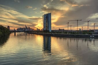 Stunning view of the Frankfurt skyline and ECB building during sunset reflecting on the Main River.