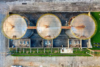 Drone view of storage tanks for oil products located in industrial refinery factory