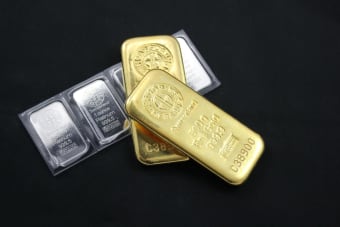Close-up of gold and platinum bars depicting wealth and investment potential.