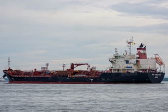 An oil tanker sailing on the open sea, ideal for maritime and logistics concepts.