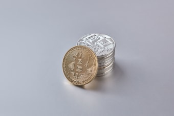 Stack of Bitcoin and cryptocurrency coins representing digital currency and financial wealth.