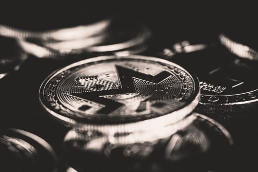 Close-up view of Monero coins showcasing cryptocurrency design with selective focus.