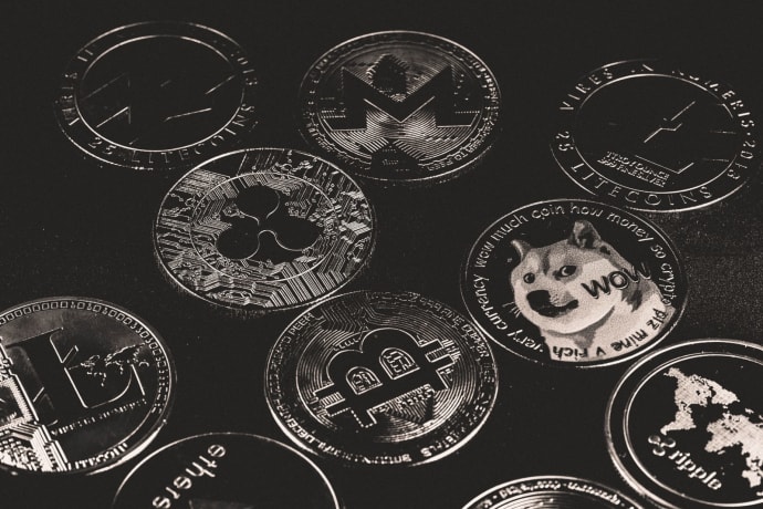 A collection of various cryptocurrency coins including Bitcoin, Ethereum, and Dogecoin.