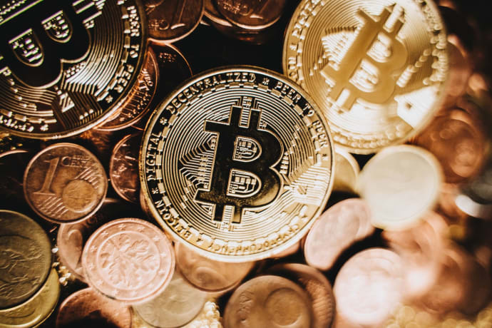Detailed close-up of bitcoin and euro coins representing cryptocurrency and traditional money in Erfurt.