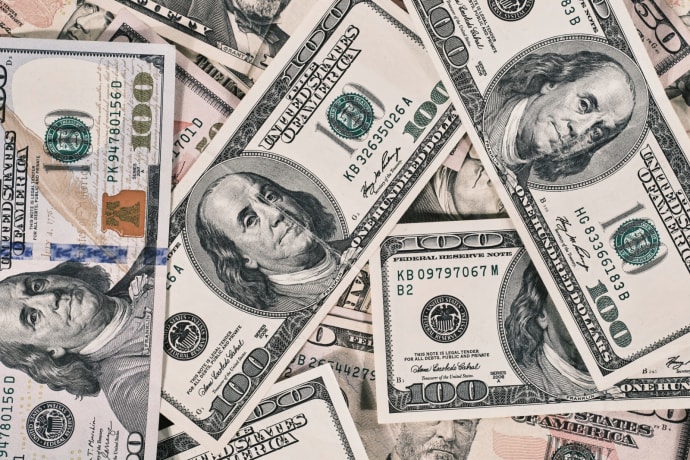 Detailed close-up of US dollar bills highlighting wealth and finance concepts.
