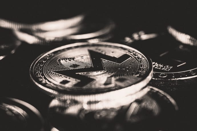 Close-up view of Monero coins showcasing cryptocurrency design with selective focus.