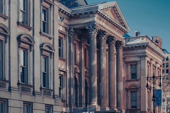 Neoclassical architecture of Tweed Courthouse in Manhattan at dusk capturing urban elegance.