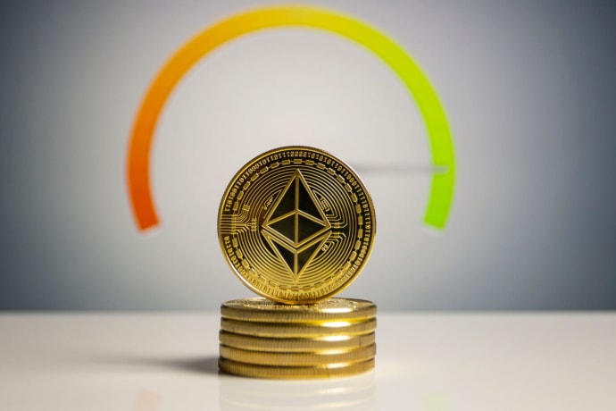 Stack of Ethereum coins with a color gradient background signifying cryptocurrency dynamics.