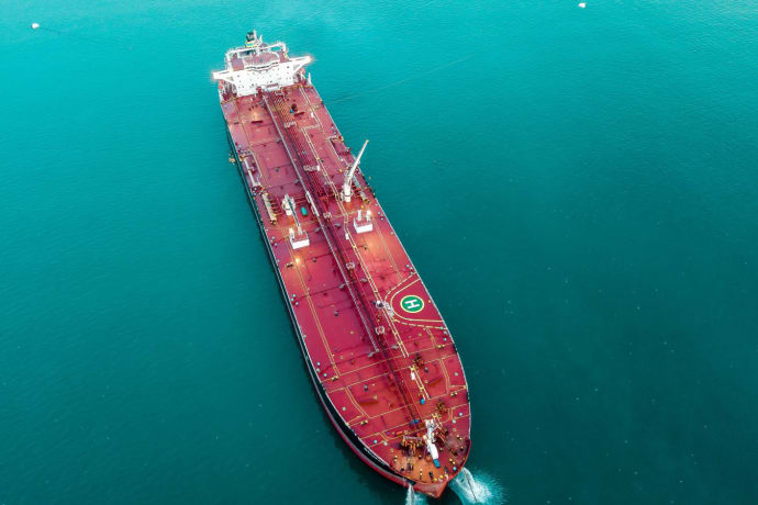 Aerial shot of an oil tanker cruising through the ocean, emphasizing maritime transport.