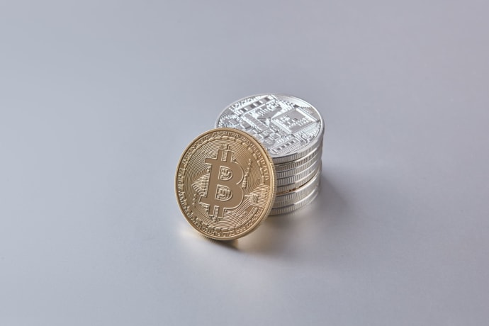 Stack of Bitcoin and cryptocurrency coins representing digital currency and financial wealth.