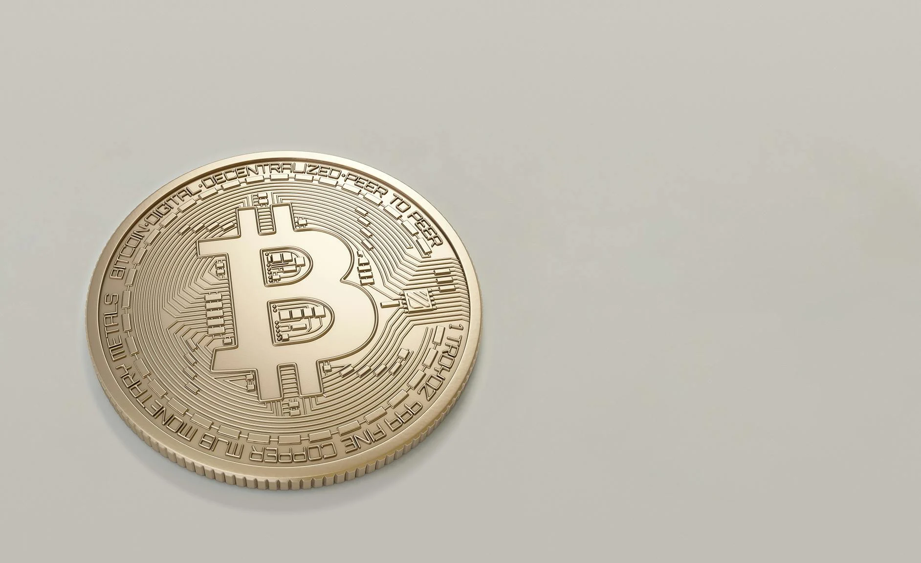 A detailed image of a Bitcoin cryptocurrency coin with a neutral background, symbolizing digital finance and currency.