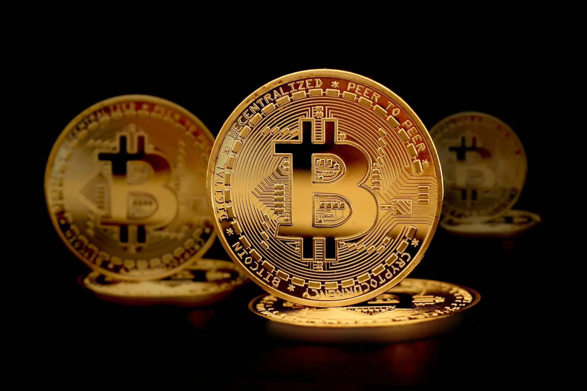 Close-up of golden Bitcoin coins symbolizing digital currency and modern finance.