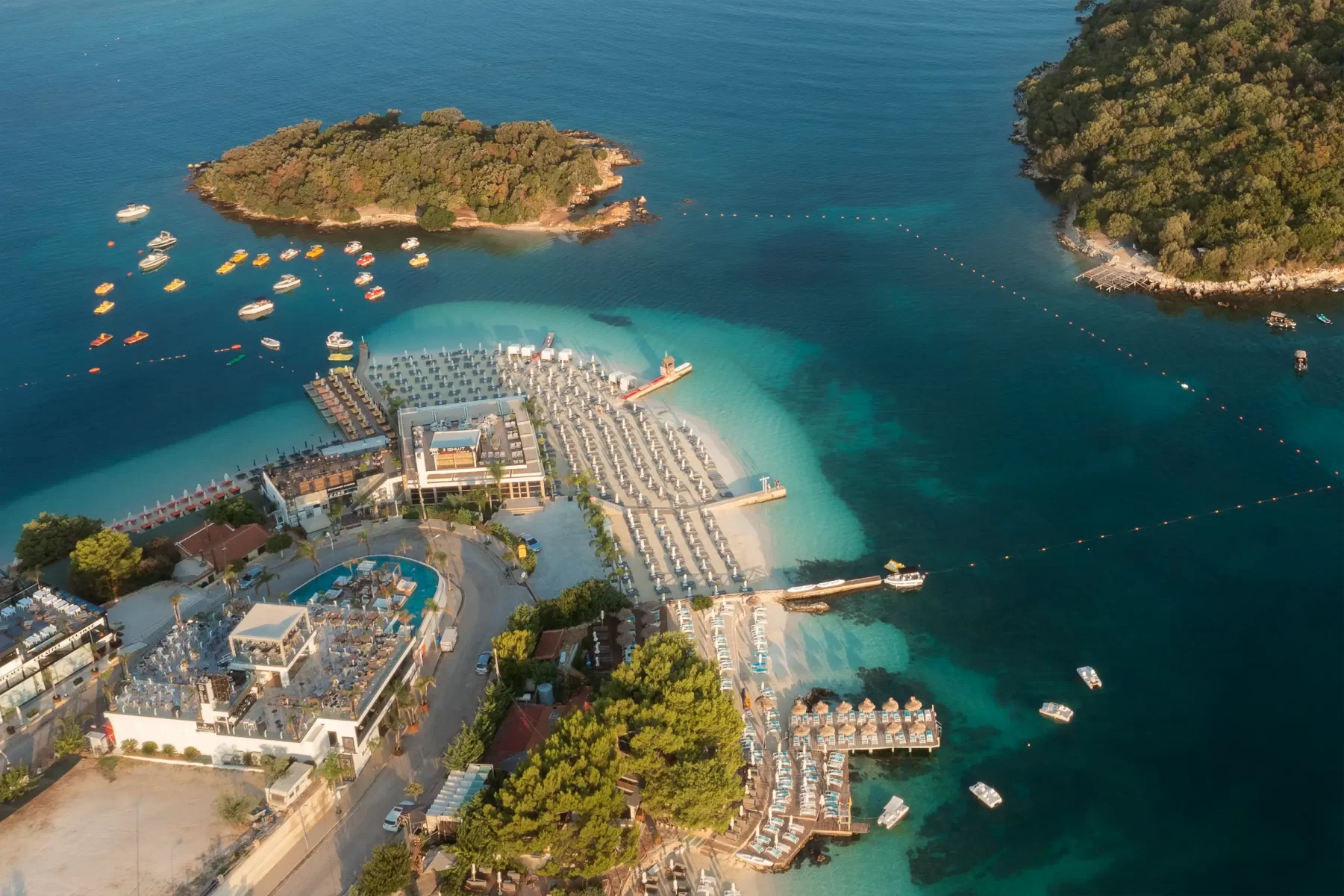 Aerial view of the beach resort, few islets and tranquile water in Albania. Hospitality photography captured by Ondrej Hromadko