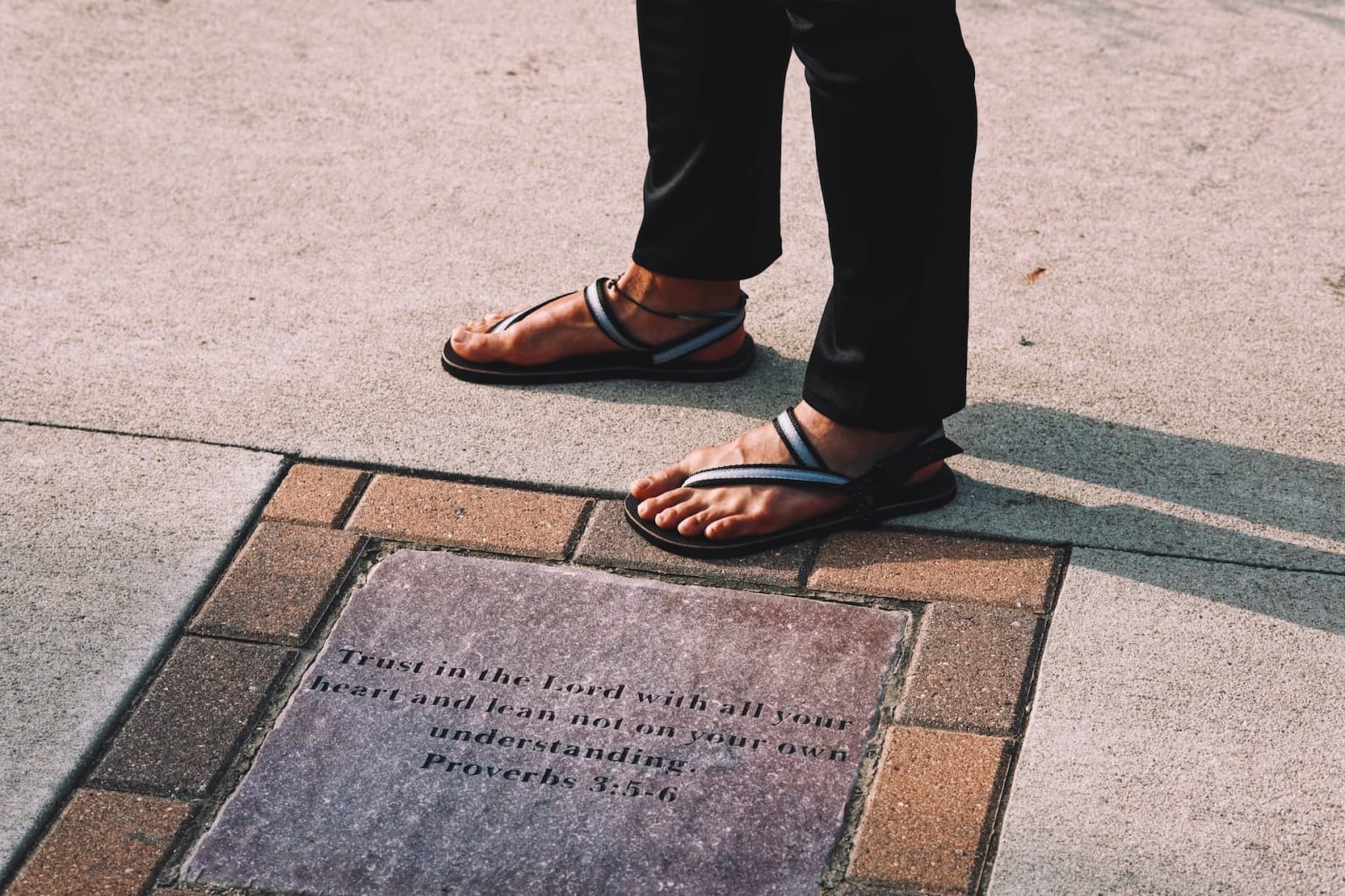 The Grounded Athlete’s Gaia sandals next to an epigraph quoting from Proverbs 3:5–6